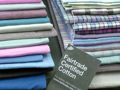 PHOTO: Pile of Folded cotton fabric with the Fairtrade Mark.